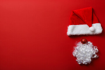 Red cap of Santa Claus with a white beard