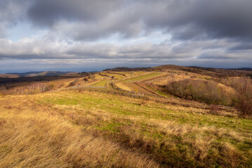 Panoramic view on the hills in a cloudy autumn day.