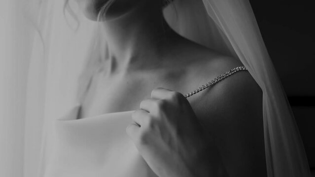 Beautiful bride close-up in a wedding dress in the morning before the ceremony, sexy girl stroking her skin