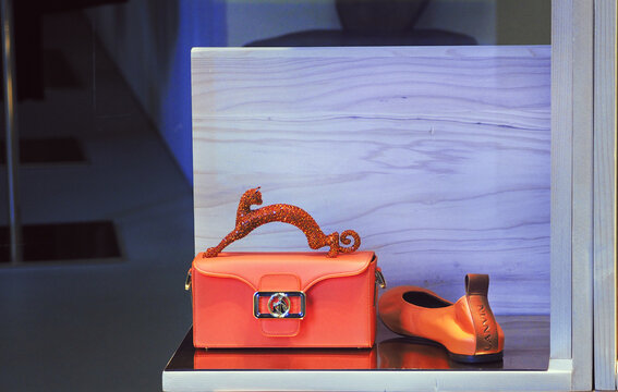 showcase with luxury accessories by Lanvin, matching orange moccasins and Pencil Chat handbag.Milan - Italy,05 November 2023