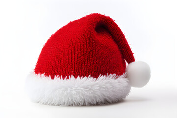 Obraz na płótnie Canvas A red Santa hat with a white pompom isolated on a white background, for Christmas holidays,