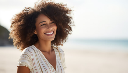 Portrait of a young black African woman in white on the beach