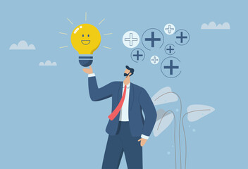 Optimism attitude or positive thinking, Emotional intelligence inspires and brings happiness in work and life, Happy businessman holding a light bulb concept smiles in a positive atmosphere.