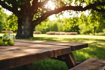 Foto op Canvas Wood table for family picnic under big tree © Golden House Images