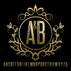 Golden patterned alphabet of capital letters set and vintage logo in monogram style. Gold letters framed in floral wreath on black.