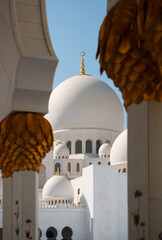 Domes and columns of Sheikh Zayed Grand Mosque made from white marble stone. Abu Dhabi, UAE - 8...