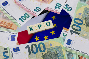 Inscription KPO which is Krajowy Plan Odbudowy next to Euro Money. and EU and Polish Flag Concept showing EU program for Poland.