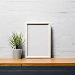 Empty wooden picture frame mockup, vertical orientation, and a flower vase placed on a white table and a white wall. simple, modern, and minimal style.