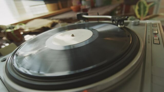Close up of record playing at vinyl turntable, retro concept, no people around