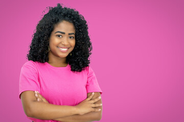 Happy mexican young adult woman on pink background - obrazy, fototapety, plakaty
