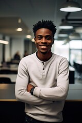 Smiling African American Young Man in Modern Office