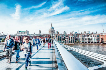 blurred image of people walking on Millenium bridge  London - obrazy, fototapety, plakaty