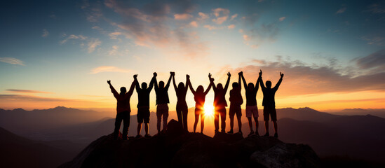 Group of team cheering on top of the mountain. Team work concept - obrazy, fototapety, plakaty