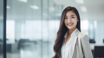 Asian Young Woman in Modern Office