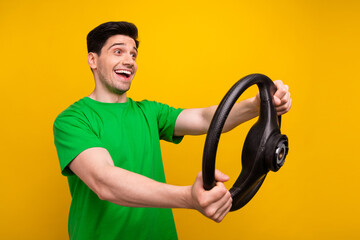 Photo portrait of attractive young brunet man hold steering wheel wear trendy green clothes...