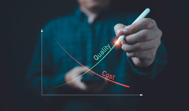 Businessman write down arrow with cost and up arrow with quality for business project management strategy have to control budget cost and improvement quality of product and service concept.
