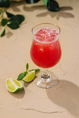 Cold summer strawberry cocktail with lime