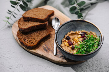 Bowl of hummus with chickpeas and bread
