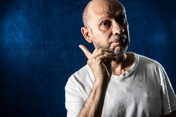 Man, confused, pointing to the side. Sad people.