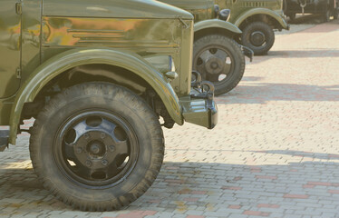 Photo of the cabins of three military off-road vehicles from the times of the Soviet Union. Side...