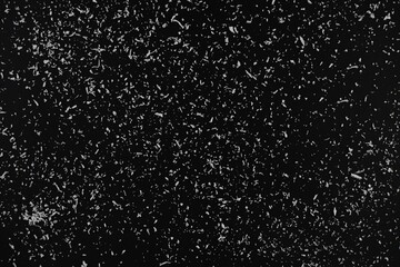 background. black background with white splashes of different sizes and shapes. artificial snow