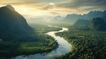 Beautiful natural scenery of river in tropical green forest with mountains in background at sunset, aerial view