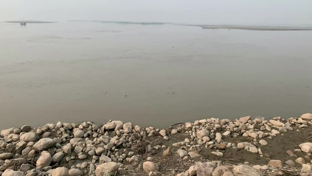 Sindh River view in punjab pakistan. Rocks in stream with smooth flowing water. beautiful natural view of sindh river. 