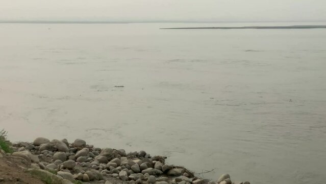 Sindh River view in punjab pakistan. Rocks in stream with smooth flowing water. beautiful natural view of sindh river. 