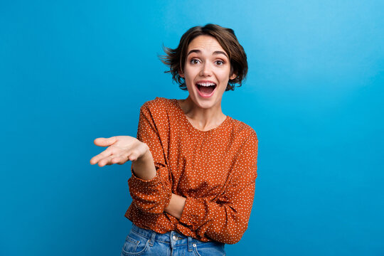 Photo of young girl gesturing her hand talking to camera wear casual outfit isolated over blue color background