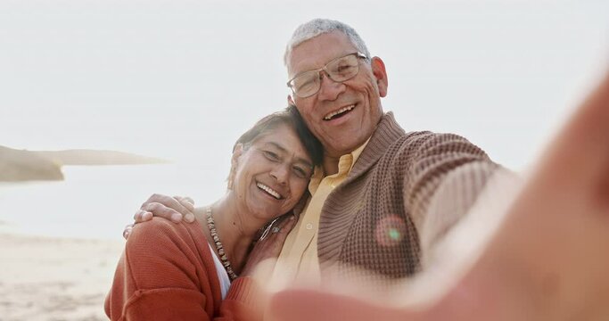 Happy senior couple, beach selfie and hug with care, bonding and summer sunshine for vacation in Mexico. Elderly woman, old man and smile on face with photography for memory by ocean, sand and waves