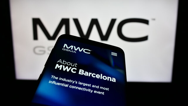 Stuttgart, Germany - 11-09-2023: Smartphone with webpage of annual mobile communications trade show MWC Barcelona in front of business logo. Focus on top-left of phone display.
