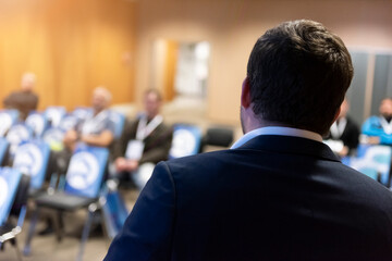 Male business coach speaker in suit give presentation, speaker presenter consulting training...