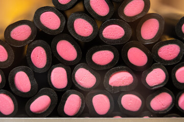 Colorful sweets displayed in a shop window, sweet texture