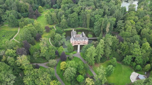 Bird's-Eye View of a Small Castle Standing on Water in the Forest