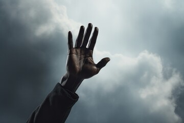 black hand raised high