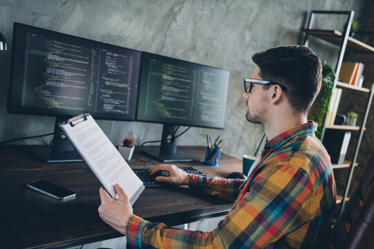 Profile portrait of experienced java script coder hold clipboard documents keyboard typing pc display office indoors