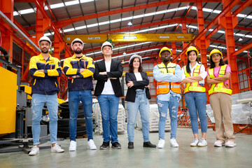 The engineering team and employees are happy to wear safety helmets. Smiling, happy working in the...