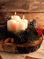Fourth Advent candle burning, traditional Christmas decoration
