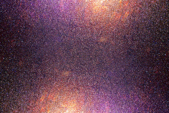 Black dark indigo blue gold orange glitter shiny abstract background for design. Twinkling glow stars effect. Fantastic, fantasy. Like outer space, night sky, universe. Grain, rough surface.