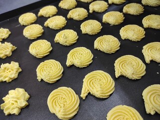 A tray of assorted cookies dough before baking