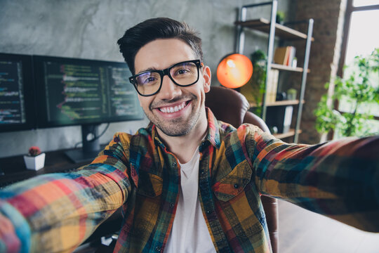 Photo of positive smart front end developer make selfie recording video workstation loft interior office indoors