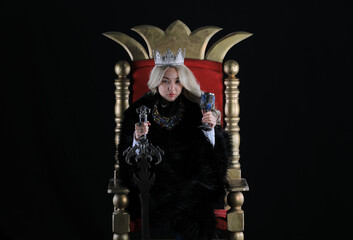 beautiful blonde viking queen on the throne