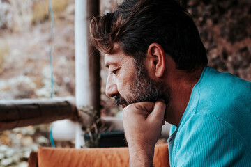 Mature man using and looking mobile phone worried at home. Modern adult people with device cellular...