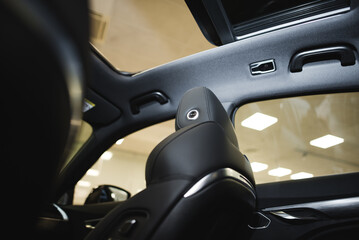 front seats and panoramic roof in an expensive car