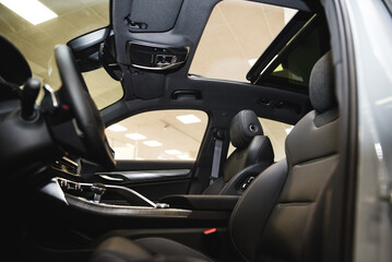 interior of an expensive car, steering wheel, panels