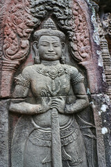 Fototapeta na wymiar A Divine Door Guardian at Banteay Kdei, Buddhist monastic temple at Siem Reap, Cambodia, Asia