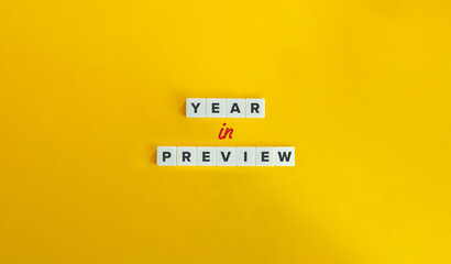 Year in Preview Concept Image. Letter Tiles on Yellow Background. Minimal Aesthetic. - obrazy, fototapety, plakaty