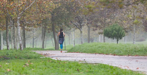 Fototapeta premium A woman running in park
