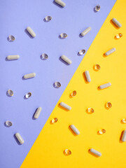 Flat lay pattern various food supplement pills on colorful background
