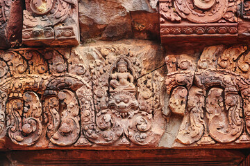 Lintel carving with bas relief of gods from Hindu mythology at Banteay Srei temple at Siem Reap,...